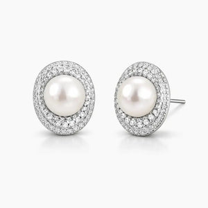 White pearl stud earrings with pavé crystal halo on silver setting, elegant jewelry