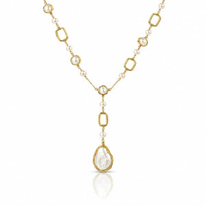A gold and pearl necklace featuring a Y-shaped design with a large teardrop-shaped pearl pendant in a gold frame, set against a clean white background with a subtle reflection.