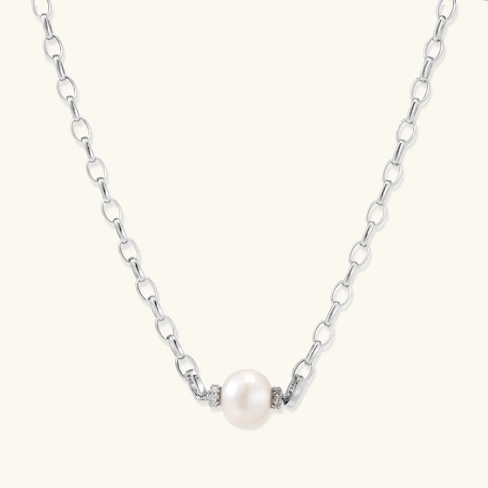 Pearl necklace with silver chain on a white background