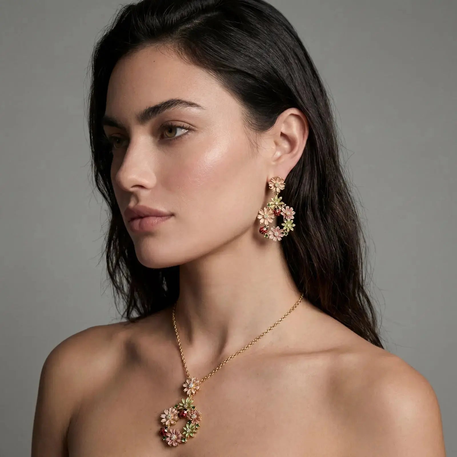 Woman wearing matching gold-plated floral CZ wreath necklace and earrings set
