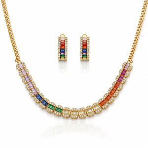 Gold necklace and matching drop earrings set with colorful baguette gemstones in pink, purple, blue, green, and red, accented with clear stones on a white background.