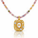 A gold pendant necklace featuring a central white pearl surrounded by small clear stones, hanging from a beaded chain with multicolored round beads on a white background.
