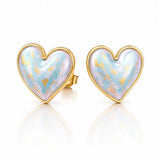 Heart-shaped earrings with gold rim and light blue interior on a white background
