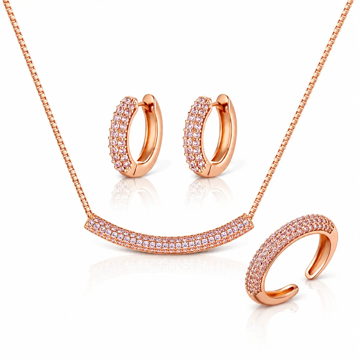 Rose gold jewelry set featuring a necklace with a pavé curved bar pendant, matching pavé hoop earrings, and a pavé open cuff ring, displayed on a clean white background.