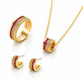Gold jewelry set featuring a ring, necklace, and earrings, each adorned with rows of red gemstones and small clear stones, displayed on a white background.