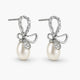 Pearl earrings with bow design on a white background
