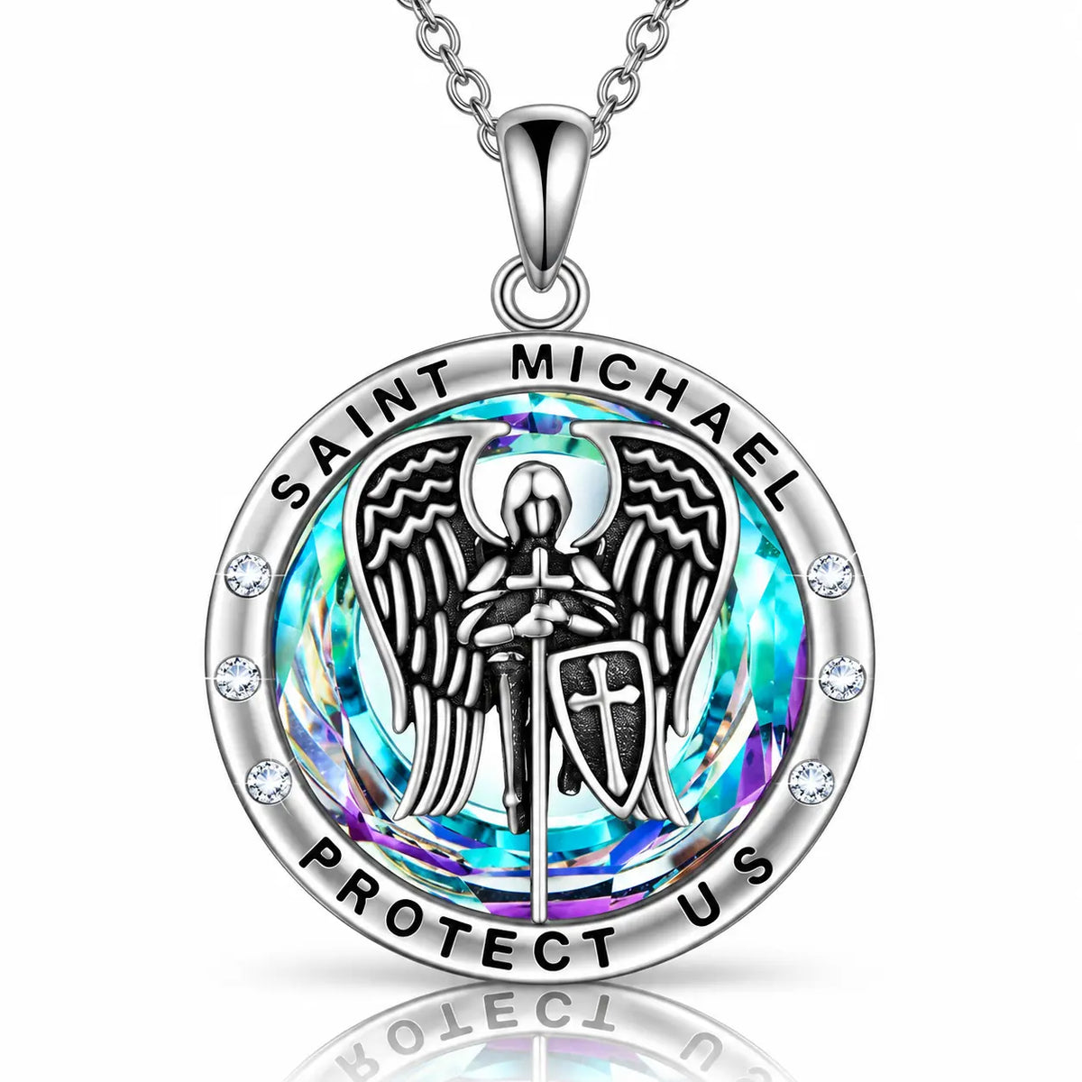 A silver Saint Michael pendant necklace featuring a detailed angel design with a sword and shield, surrounded by a vibrant iridescent blue and purple background, with small clear rhinestones along the outer silver bezel. The pendant is shown on a matching silver chain against a clean white background with a subtle reflection.