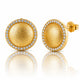 A pair of gold dome stud earrings with a halo of small clear stones, shown on a white background with a soft reflection below. One earring is facing forward, showing the textured gold center and the side post with a '925' sterling silver mark, while the other is turned sideways.