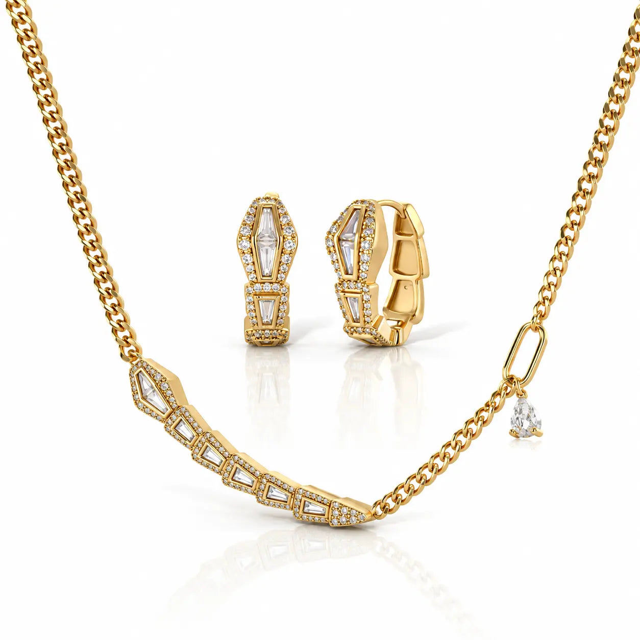 Gold jewelry set featuring a curved bar necklace, matching huggie hoop earrings, and a small dangling charm, all adorned with clear stones on a white background.