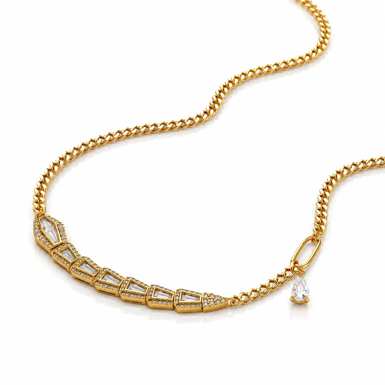 A gold chain necklace featuring a curved bar of clear rectangular and marquise-cut stones, accented with small clear stones, and a small teardrop-shaped clear stone pendant, shown on a white background.