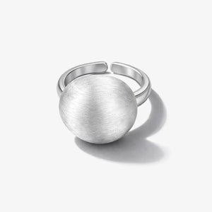 Matte brushed silver dome ring with open band on white background