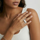 Woman wearing a chunky 925 sterling silver wave ring on hand, minimalist jewelry style