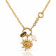 A gold chain necklace featuring a sunburst charm, a black stone-accented ring, a white pearl bead, and a line of clear cubic zirconia stones on a white background.