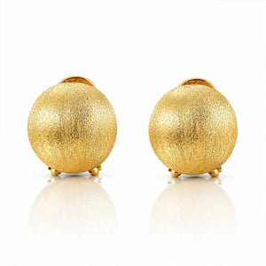 A pair of gold textured spherical stud earrings with small gold post backs, displayed on a clean white reflective surface.