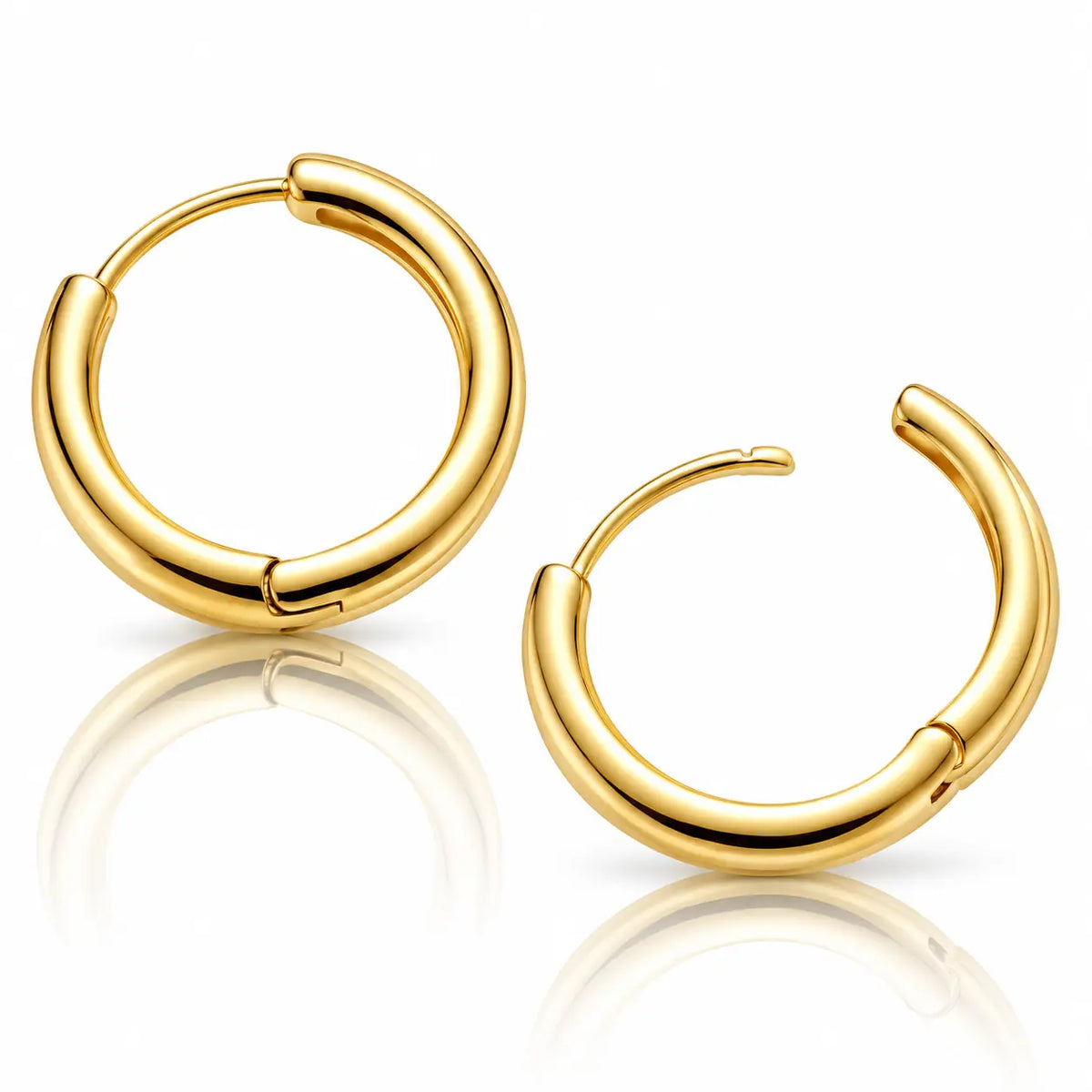 A pair of polished yellow gold huggie hoop earrings with a smooth, rounded tubular design, displayed on a clean white background with a soft reflection below.
