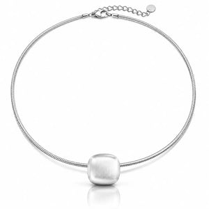 A silver snake chain necklace with a large, rounded, brushed-metal cube pendant, displayed on a clean white background with a soft reflection.