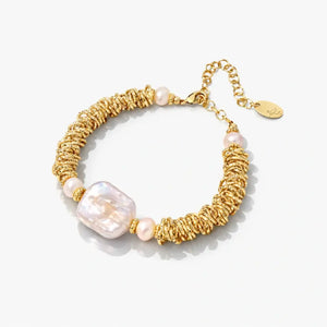 18K gold-plated spiral bracelet with freshwater pearls on white background