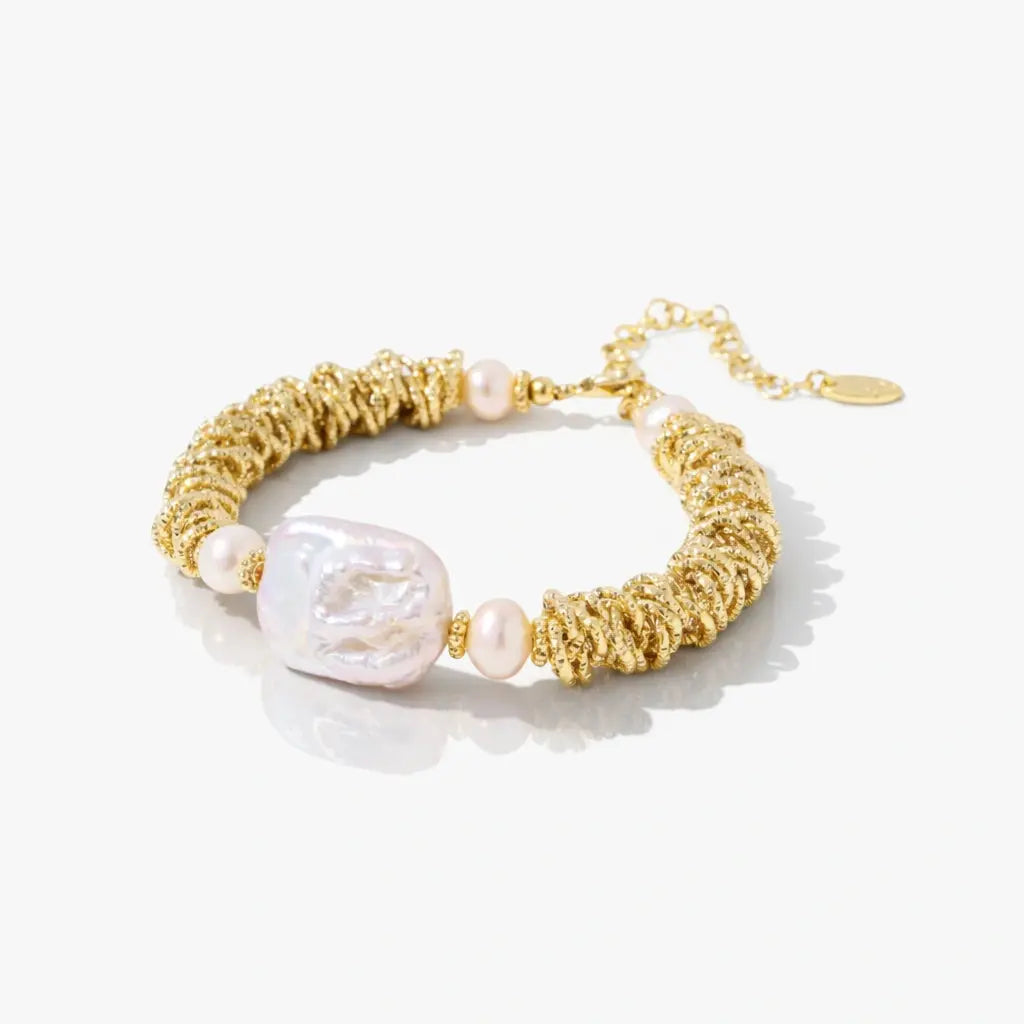18K gold plated bracelet with spiral textured links and freshwater pearl accents on white background