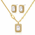 Gold jewelry set featuring a rectangular pendant necklace, matching stud earrings, and a chain, with clear rectangular gemstones surrounded by small sparkling stones on a white background.