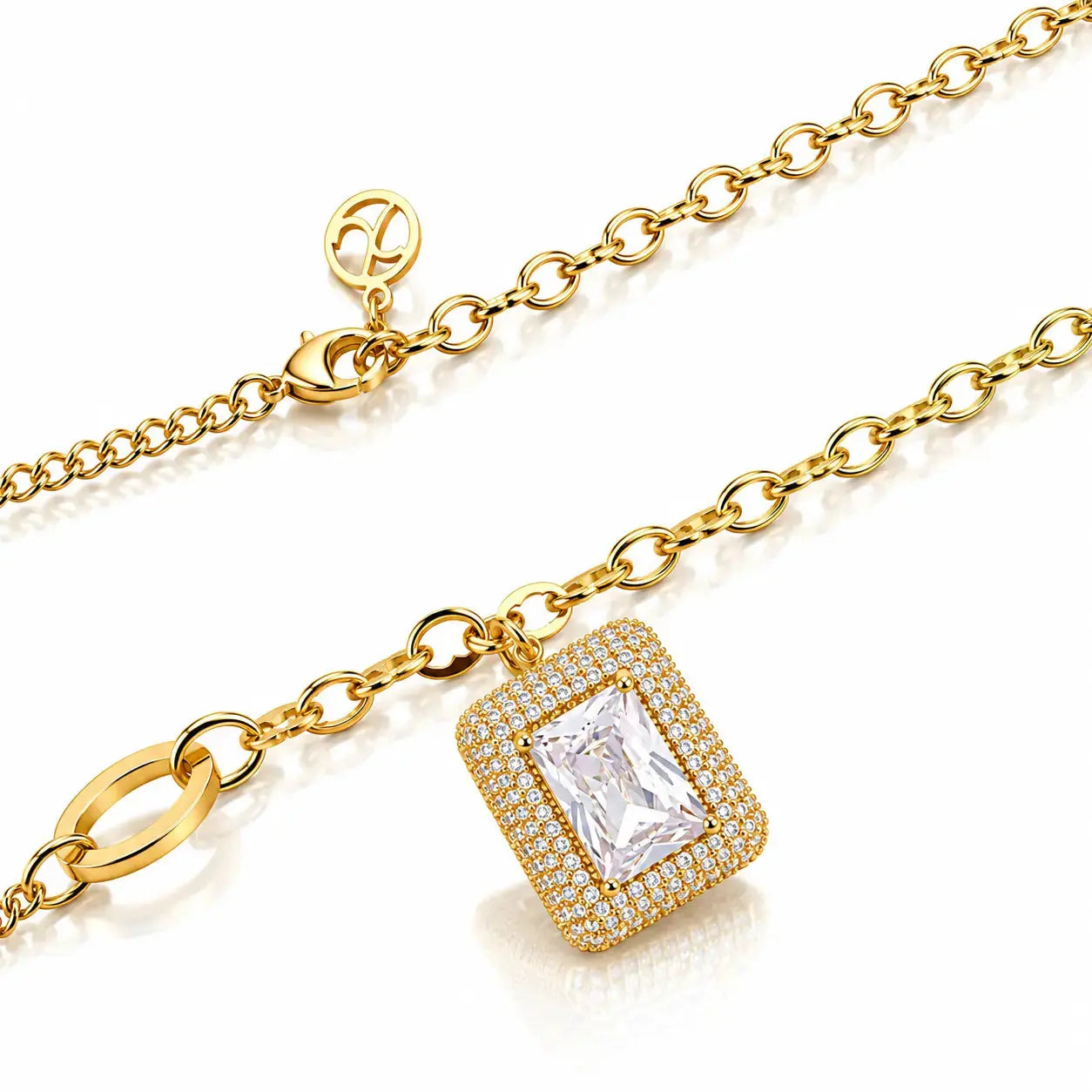 A gold chain necklace with a rectangular halo pendant featuring a clear emerald-cut center stone surrounded by small clear stones, shown on a white background.