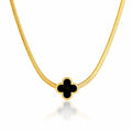 Gold necklace with a black clover-shaped pendant on a white background