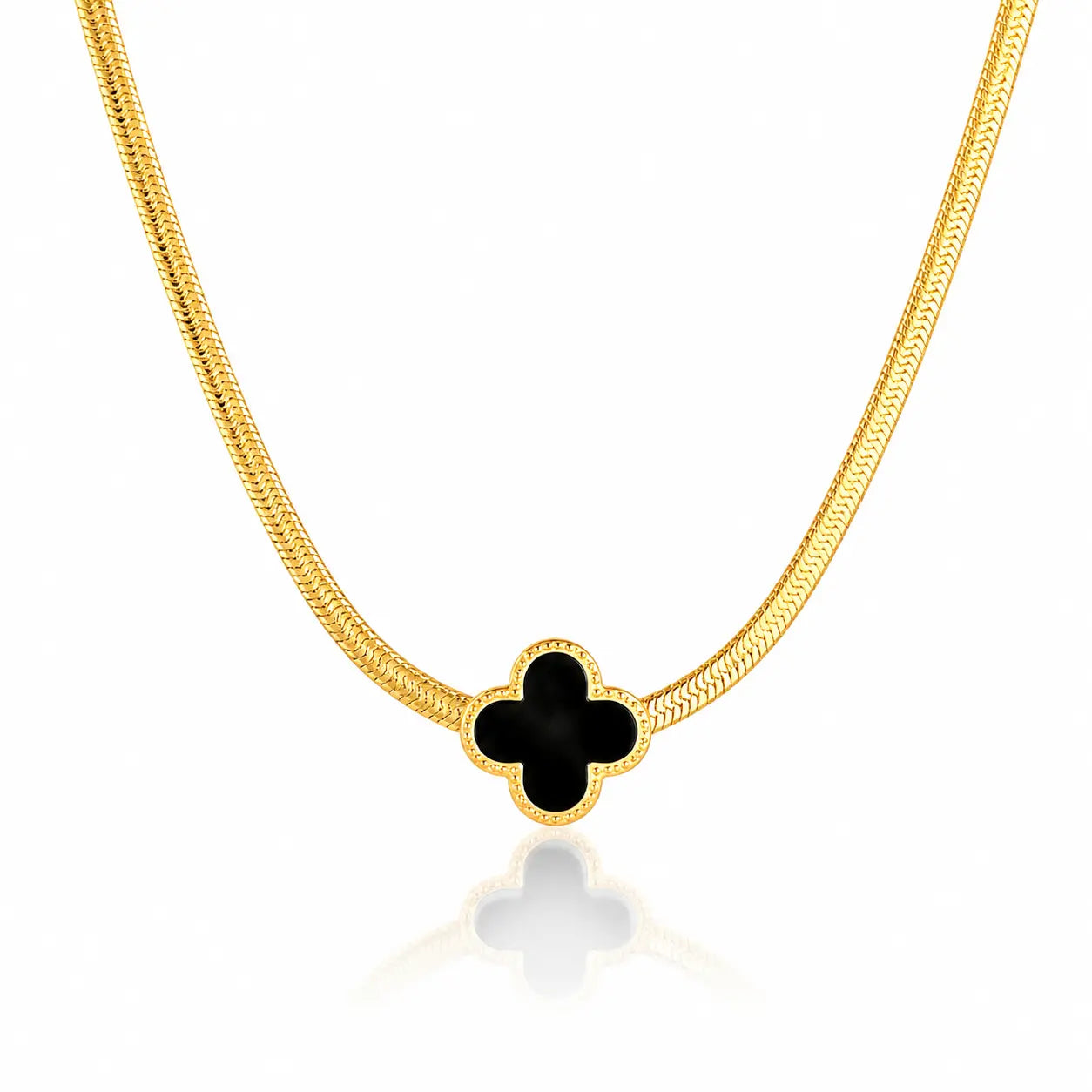Gold necklace with a black clover-shaped pendant on a white background