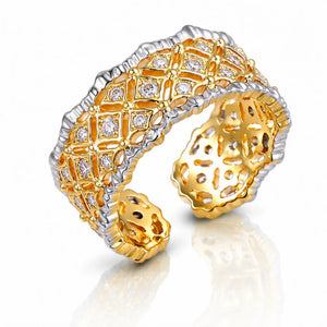 Gold and silver bracelet with diamond accents on a white background