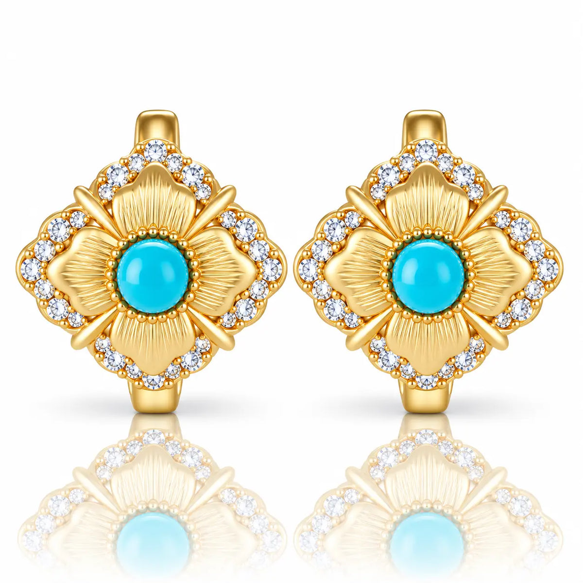 A pair of gold flower-shaped earrings with turquoise blue center stones and clear accent stones, shown on a white background with a soft reflection below.