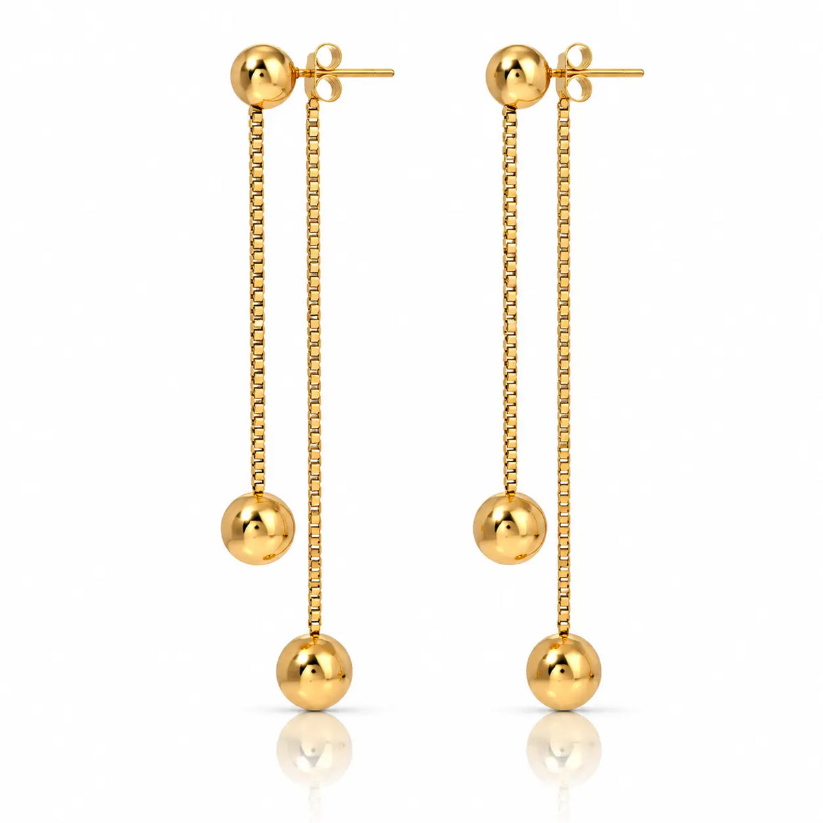 A pair of gold dangle earrings with spherical beads, shown on a clean white background with a subtle reflection below.