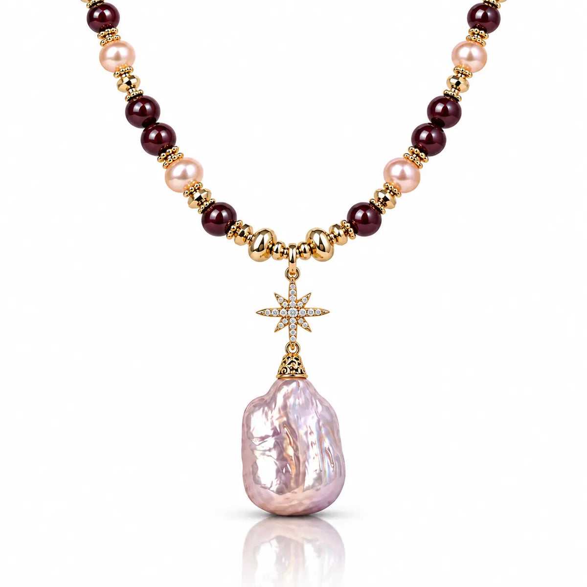 A luxury necklace featuring a large, irregular light pink baroque pearl pendant, suspended from a gold star charm. The chain is composed of alternating dark burgundy beads, light pink pearls, and polished gold spacer beads.