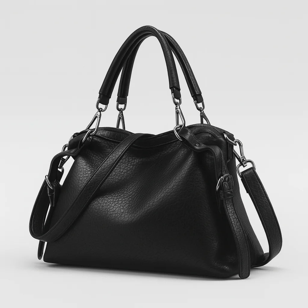 Soft black PU leather handbag with Boston silhouette and detachable crossbody strap, designed for versatile everyday use.