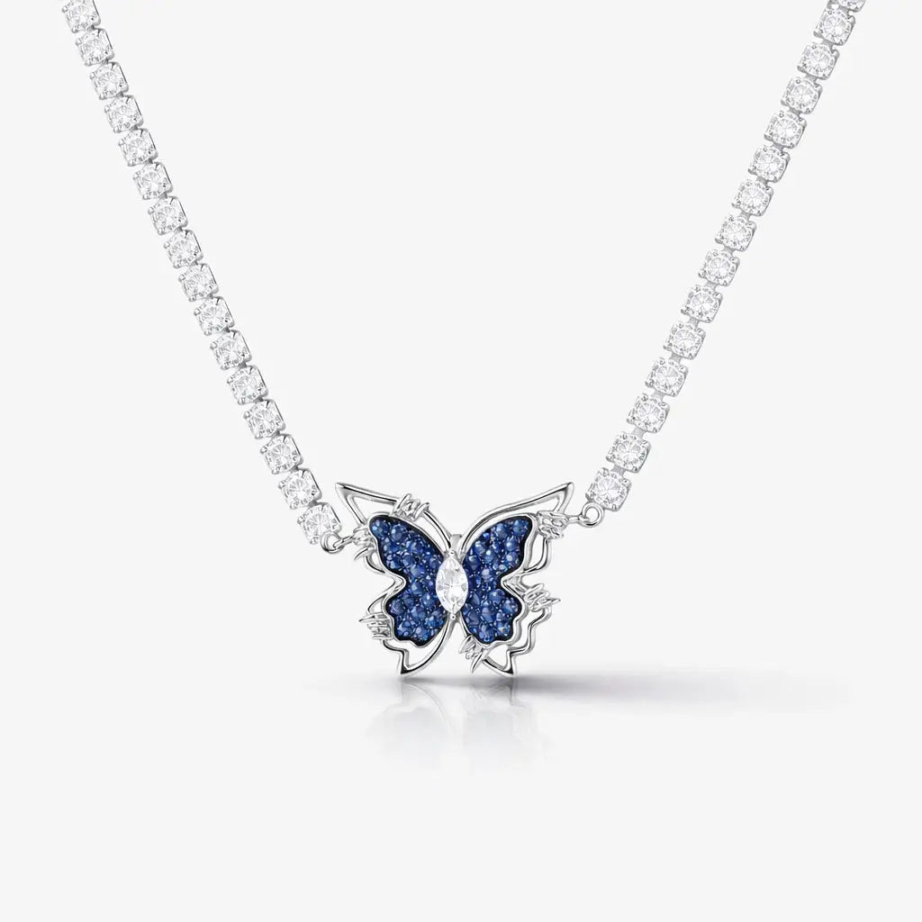 Silver tennis necklace with blue gemstone butterfly pendant and clear round stones
