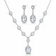 A silver-tone jewelry set featuring a V-shaped necklace and matching drop earrings, both adorned with clear round and oval gemstones, shown on a plain white background.