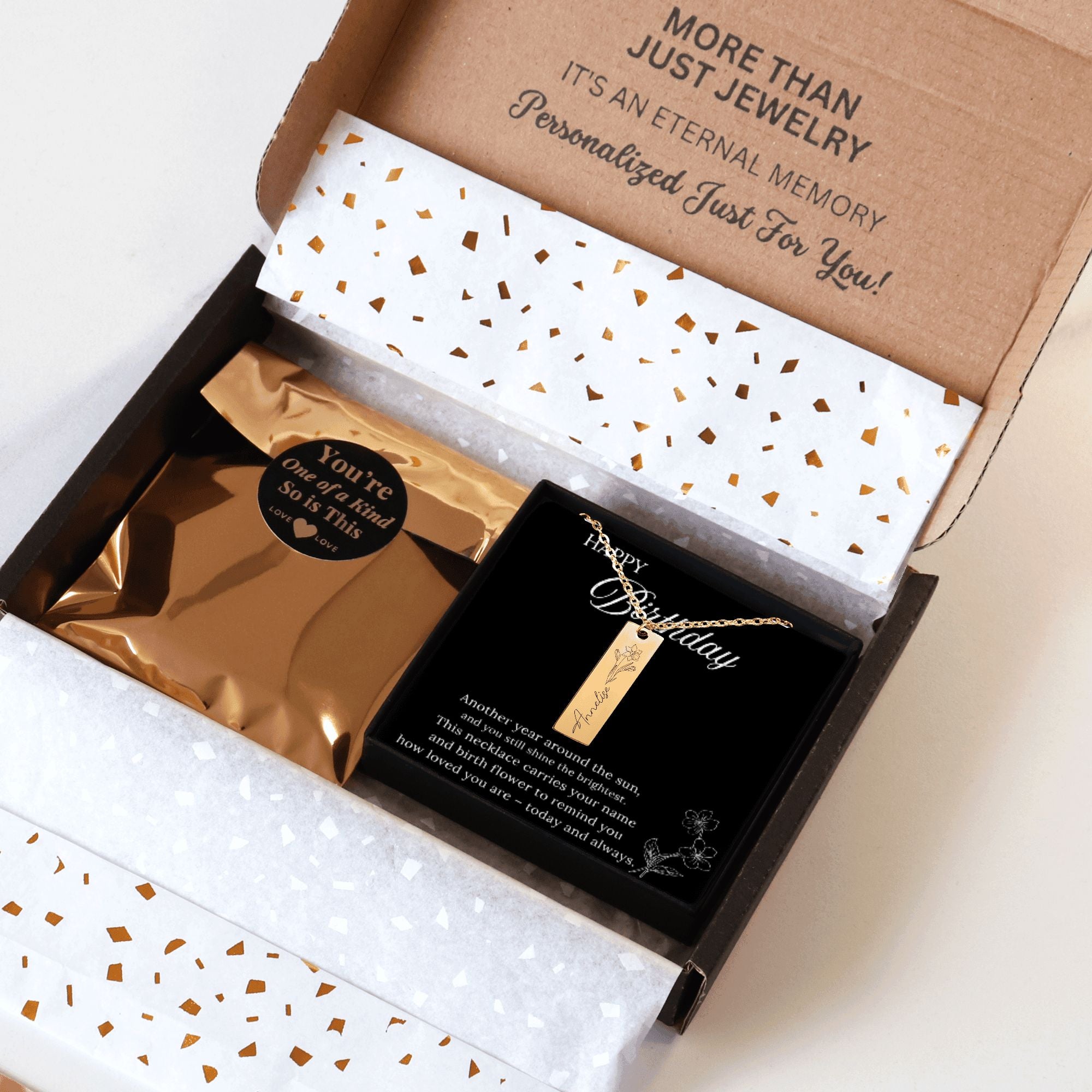 Jewelry box with a necklace and card inside, featuring text about personalized jewelry.