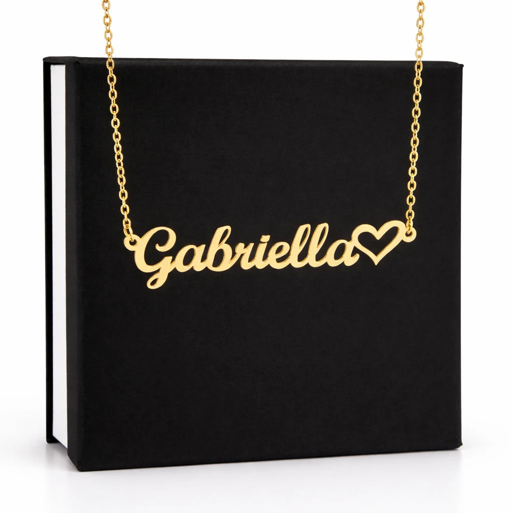 Gold necklace with 'Gabriella' and a heart on a black box