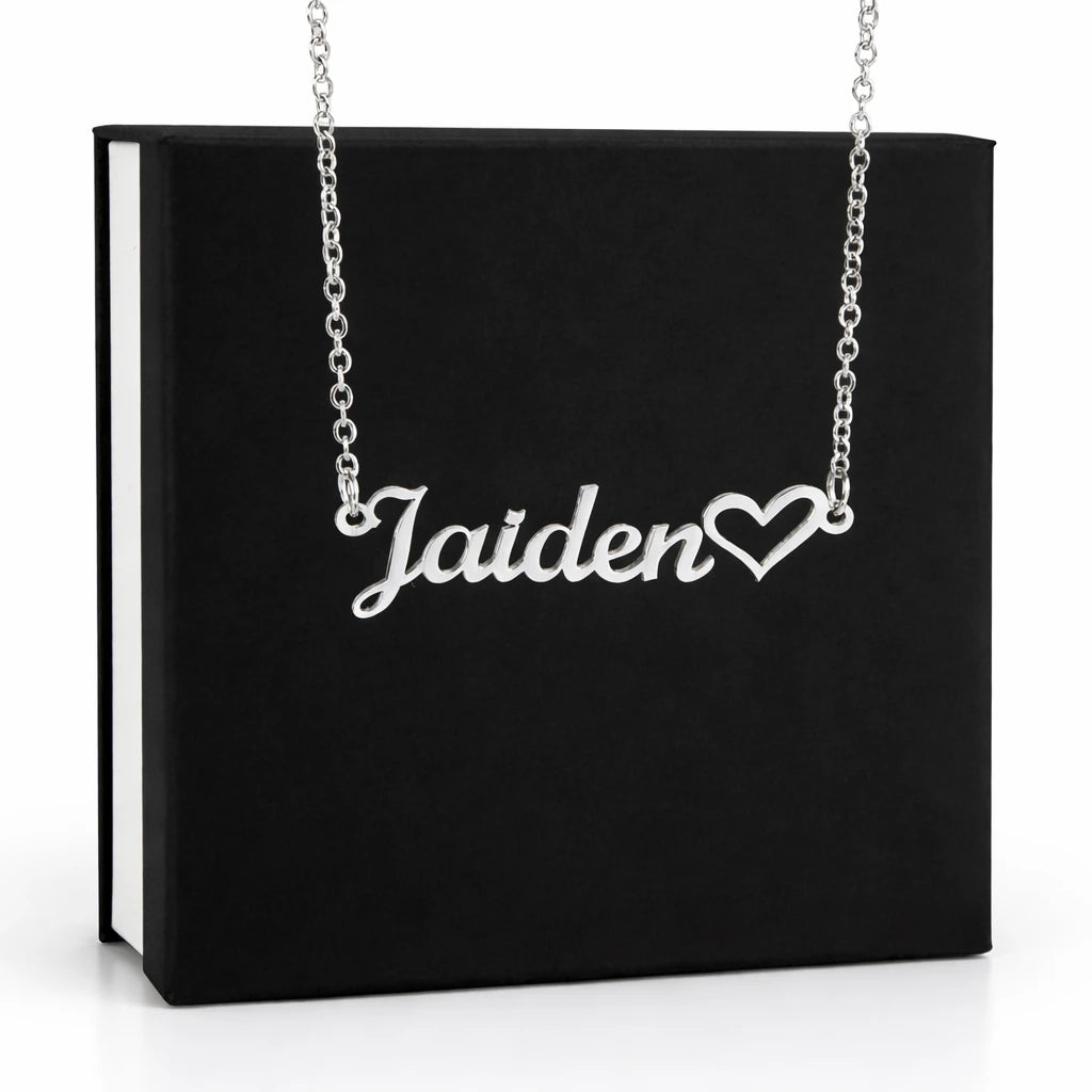 Silver 'Jaiden' necklace with a heart charm on a black box background